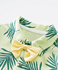 Green leaf-patterned outfit with a yellow bow tie on a white background