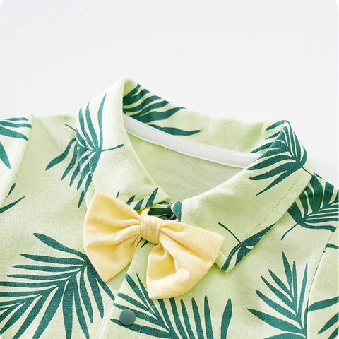 Green leaf-patterned outfit with a yellow bow tie on a white background