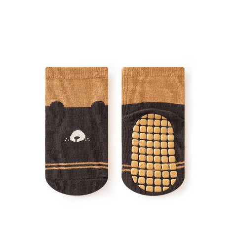 Pair of brown and black socks with a bear design on a white background