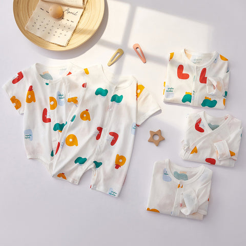 Baby clothing set with colorful patterns on a light gray background