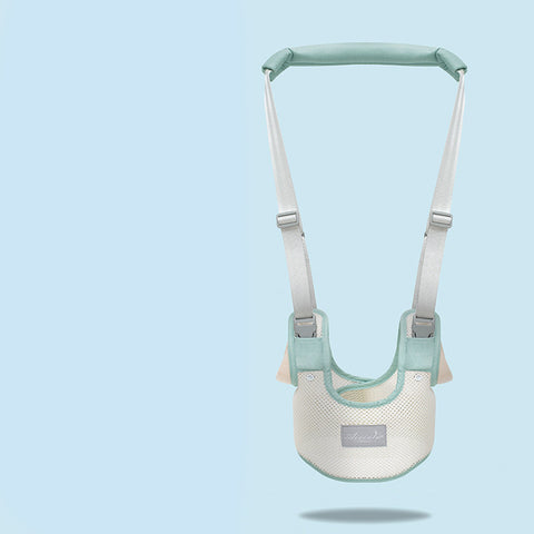 Baby safety harness with green straps on a light blue background