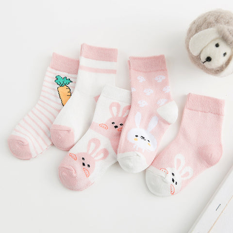 Set of baby socks with cartoon designs on a white surface