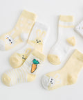 Set of baby socks with cartoon designs on a light background