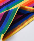 Colorful striped fabric with a quality assurance label on a white background