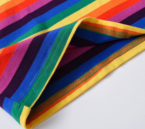 Colorful striped fabric with a quality assurance label on a white background