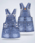 Two denim overalls on a white background
