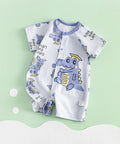 Baby romper with dinosaur pattern on a light green background