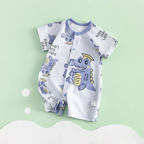 Baby romper with dinosaur pattern on a light green background