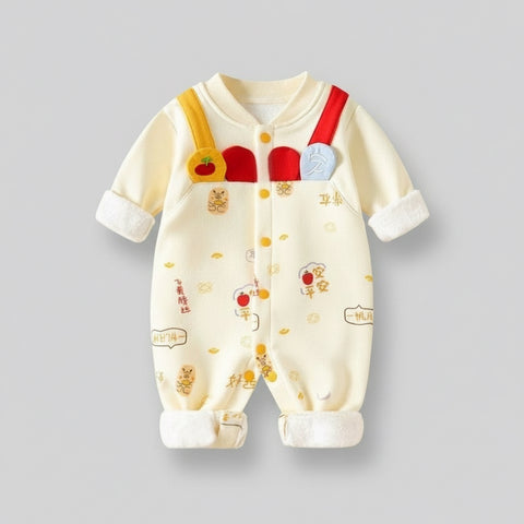 Baby onesie with suspenders on a yellow background, featuring text and graphics.