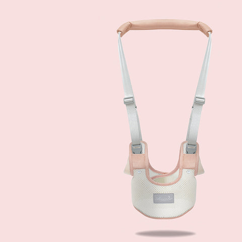 Baby carrier with pink straps on a light pink background