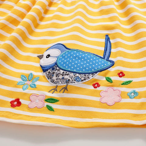 Yellow fabric with blue bird and floral design