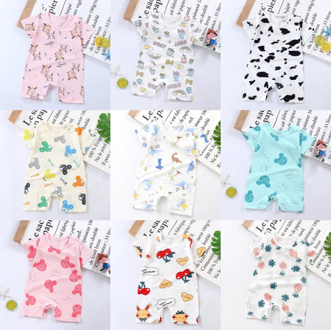 Six baby rompers with different patterns on a gray background