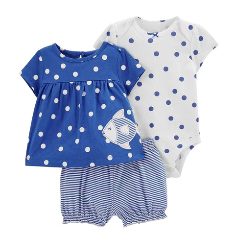 Baby outfit set with blue and white polka dot top, white onesie with blue polka dots, and striped shorts on a white background.
