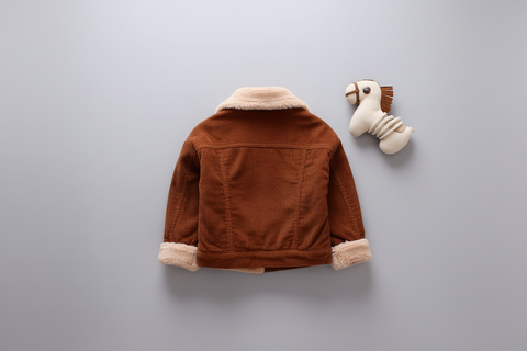 Brown children's jacket with white fur lining on a gray background