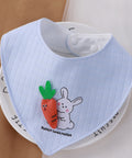 Baby bib with cartoon rabbit and carrot design on a white background