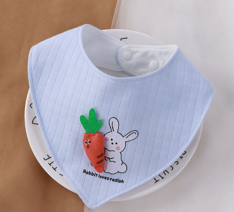 Baby bib with cartoon rabbit and carrot design on a white background