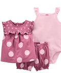 Pink polka dot dress, romper, and tank top set on a white background