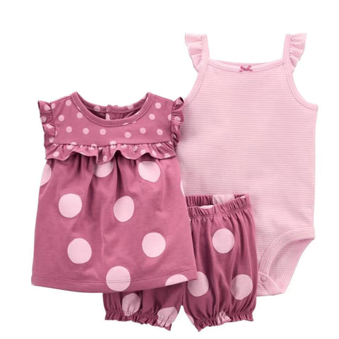 Pink polka dot dress, romper, and tank top set on a white background