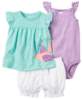 Set of children's clothing including a top, shorts, and swimsuit on a white background