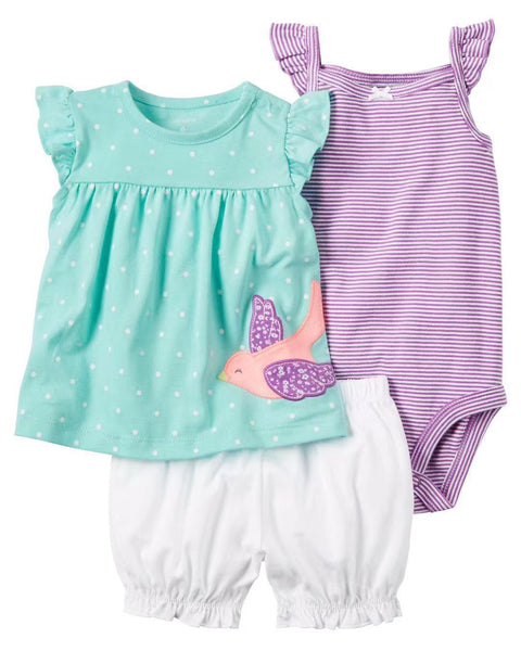 Set of children's clothing including a top, shorts, and swimsuit on a white background