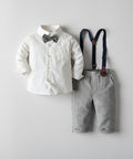 Children's outfit with white shirt, gray pants, and suspenders on a light gray background
