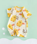 Baby romper with duck pattern on a light green background