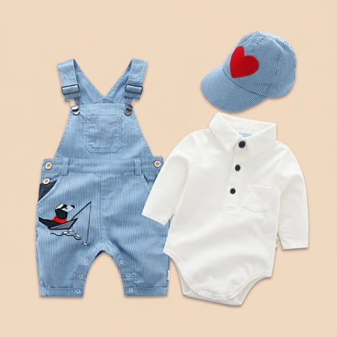 Baby outfit set with blue overalls, white romper, and cap on a white background