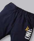 Navy blue shorts with 'ONE' and crown logo on a white background