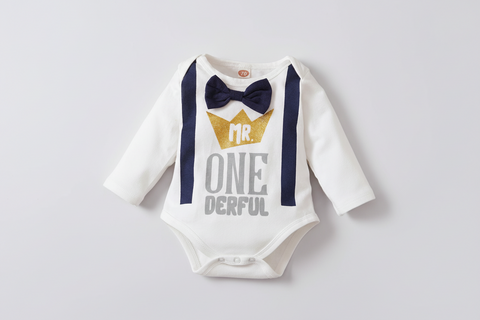 Baby outfit with bow tie, suspenders, and 'Mr. One Derful' text on a white background