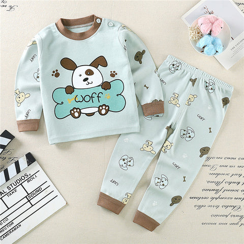 Children's pajama set with cartoon dog design on a light background