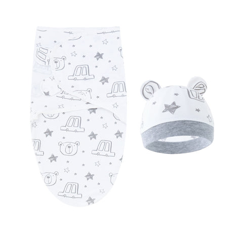 Baby blanket and hat set with animal patterns on a white background