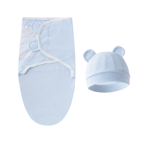 Blue baby swaddle and hat set on a white background
