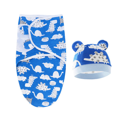 Baby swaddle and hat set with dinosaur pattern on a white background