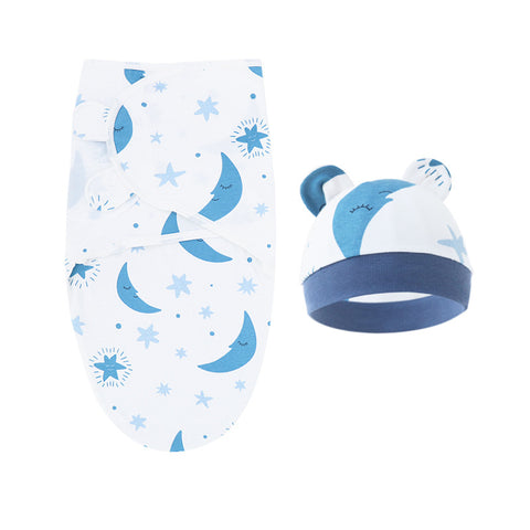Baby swaddle blanket with moon and star pattern and matching hat on a white background