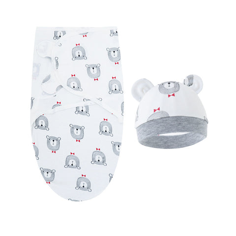 Baby swaddle with bear pattern and matching hat on a white background