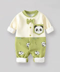 Green baby romper with panda design on a gray background