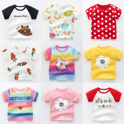 Collection of colorful children's t-shirts with various designs on a white background