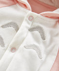 Close-up detail of cotton hooded jumpsuit bunny ear hood and soft fleece lining