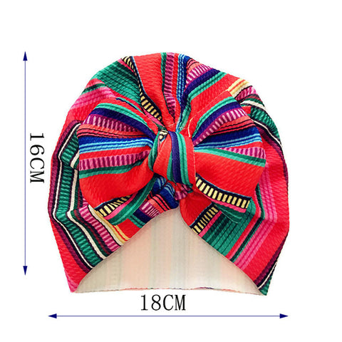 Colorful headwrap with measurements on a white background