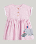 Pink dress with a bunny design on a white background