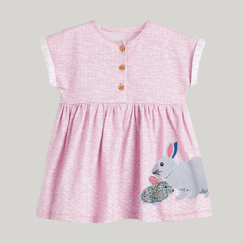 Pink dress with a bunny design on a white background