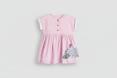 Pink dress with a rabbit design on a white background
