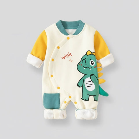 Baby onesie with dinosaur design on a light gray background