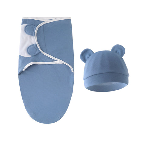 Blue baby swaddle and hat set on a white background