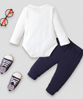 White long-sleeve shirt and navy pants with baby shoes on a white background