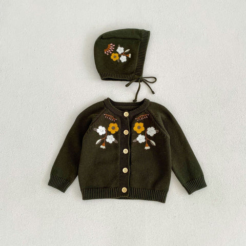 Children's brown cardigan and bonnet with floral embroidery on a light gray background