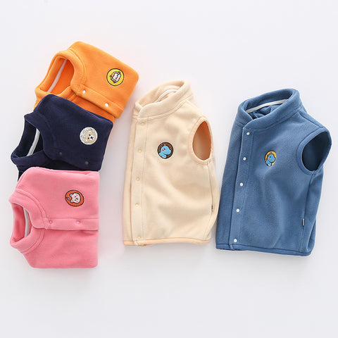 Five children's vests in different colors on a white background