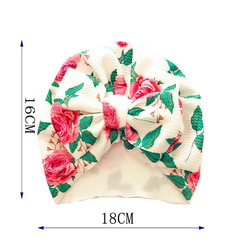 Floral patterned headscarf with measurements on a white background