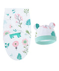 Baby hat and swaddle with floral and animal pattern on a white background