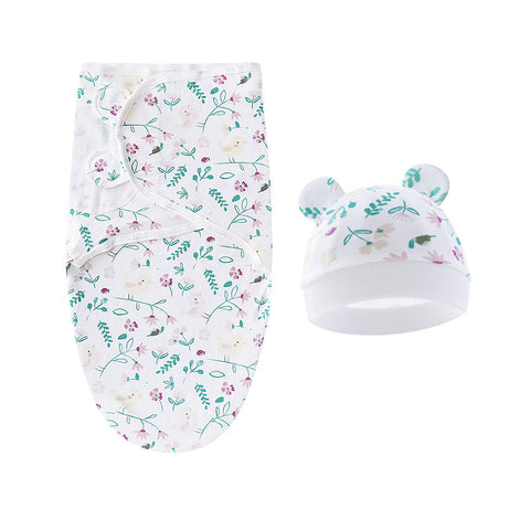 Baby swaddle and hat set with floral pattern on a white background